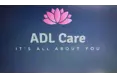 ADL Care - A company logo
